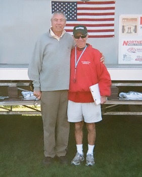 Photo of Santo Paniccia with a runner from the 4th Annual E. J. Herrmann
