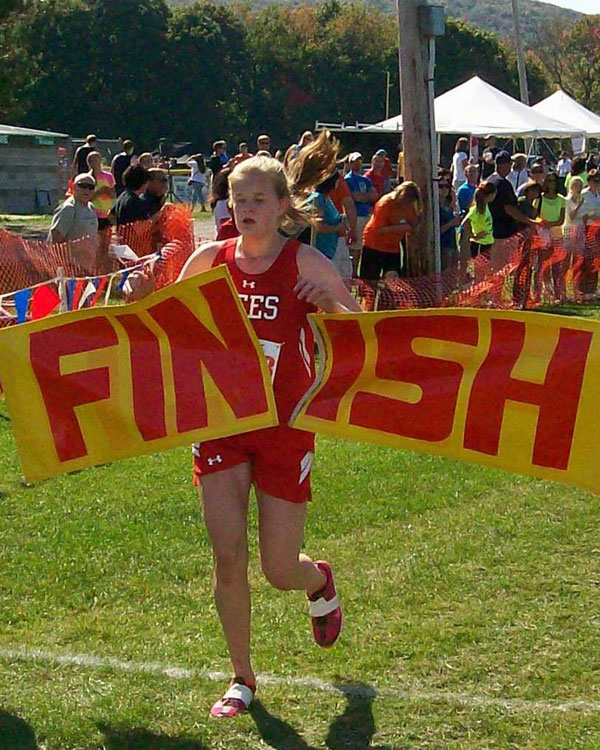Image of the Utica Police and Fire Fighters Memorial Girls JV race winner Sarah Rodman from Baldwinsville