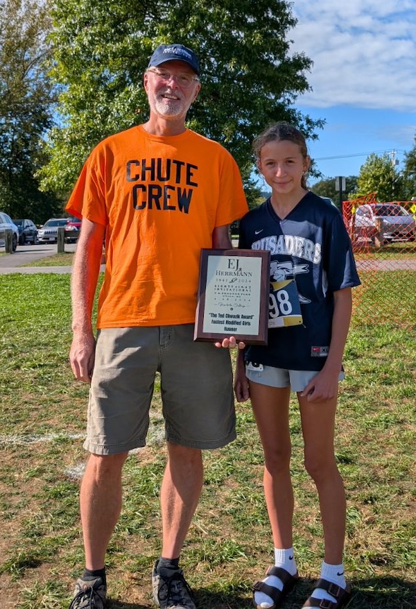 Image of the Ted Chwazik Award award winner Hannah Reilly from St. Mary - Brockville, presented by Mr. Gerard Chwazik, favorite brother of Mr. Ted Chwazik
